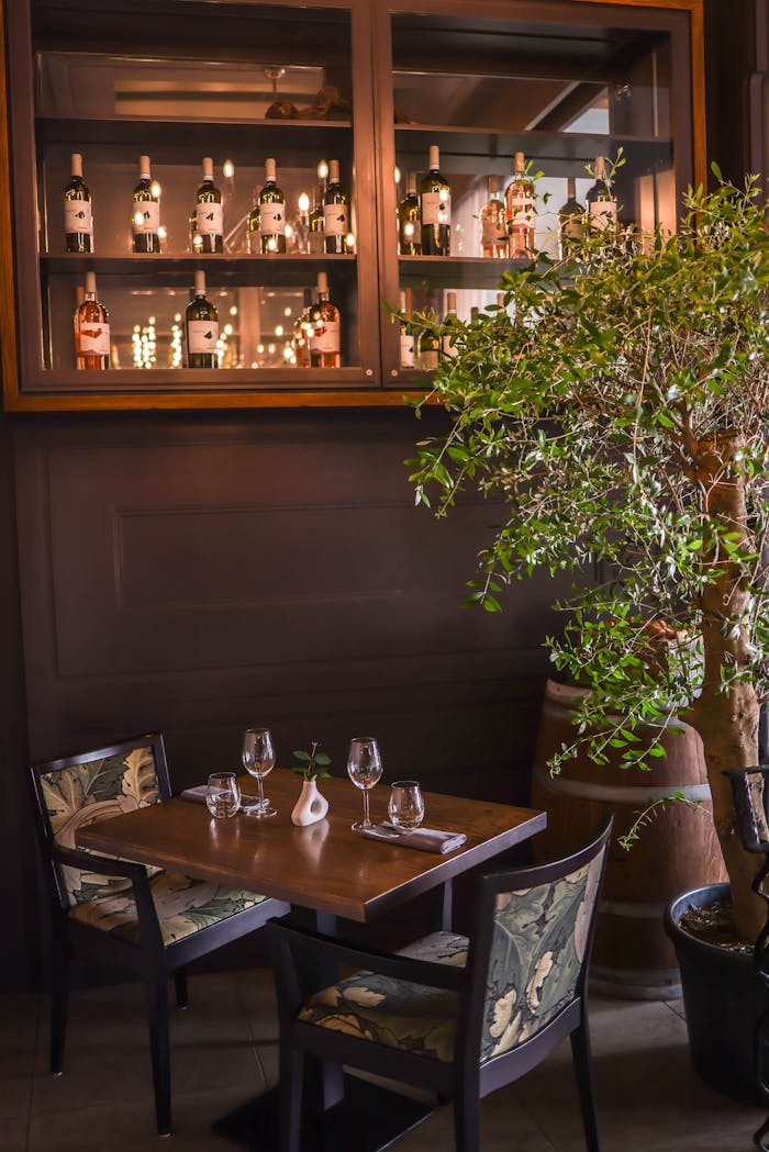 Intimate dining setting with wine decor, perfect for a classy home interior.